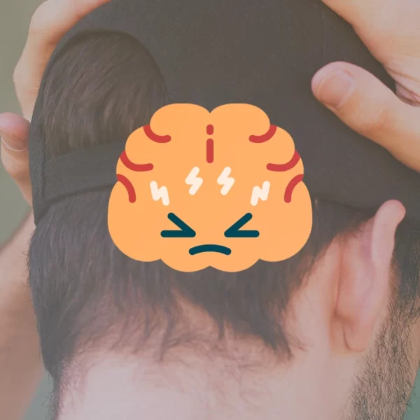 La cabeza de una persona con un cerebro, experimentando dolores de cabeza por ansiedad.